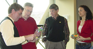 Image of four class participants solving a problem in a Communication Savvy class.
