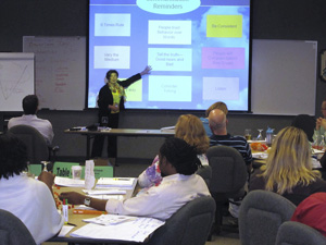 Image of Jan Hovrud facilitating training for a classroom of people.